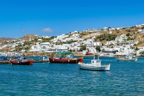 Mykonos, Cyclades, Greece - fishing boats are moored in the old port of Mykonos Town, Mykonos Chora