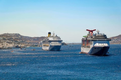 Mykonos, Cyclades, Greece - cruise ships CARNIVAL MIRACLE and COSTA FORTUNA are located in the bay