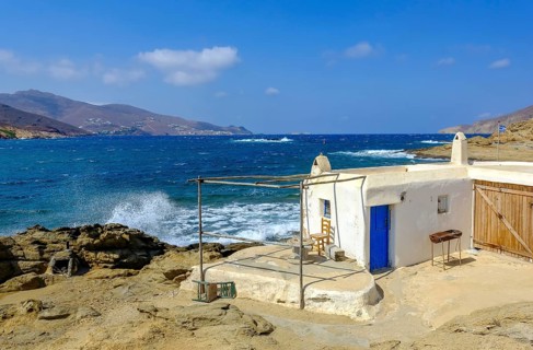 Mykonos, Cyclades, Greece - Ftelia Beach, fishing lodge on Ftelia beach, sandy beach on windy rocky
