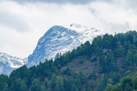 View into the mountains next to Lake Almsee on a rainy day in spring, Traunstein summit,
