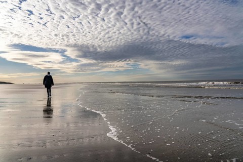 Walkers on the Wadden Sea near the East Frisian island of Spiekeroog, west of the North Sea island,