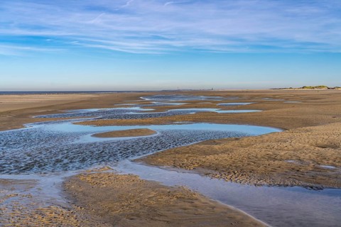 East beach of the East Frisian island of Spiekeroog, at low tide, tidal creek, watercourse at low