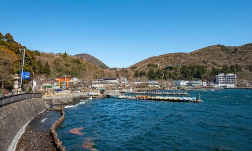 View of bay with boat docks, Motohakone town, Hakone, Japan