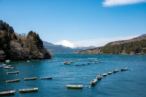 Attached rowing boats, view of Lake Ashi with Mount Fuji volcano, Hakone, Japan