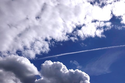 Cloudy sky with contrails, Germany