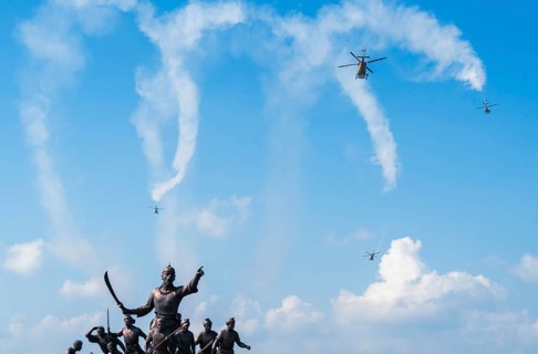 Indian Air Force aerobatic team performs during rehearsals ahead of the air show organised as part