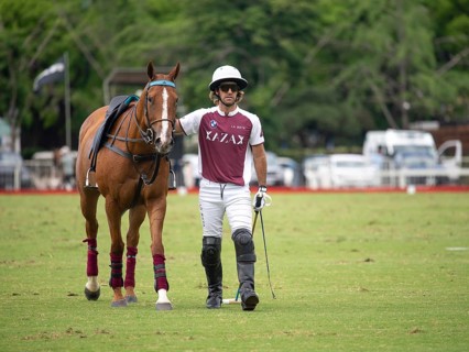 Polo player Nicolas Pieres from Team Zeta Kazak with his injured horse, the bleeding wound visible