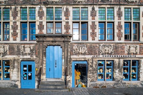 Façade of 17th century baroque guildhall Korenmetershuis at the Graslei in the city Ghent, East