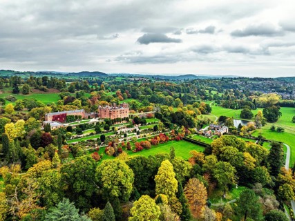 Autumn colours over Powis Castle and Garden from drone, Welshpool, Powys, Wales, England, United