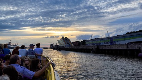 Harbour ferry line 62 with passengers on the Elbe, harbour cruise at sunset, Docklands, Hamburg,
