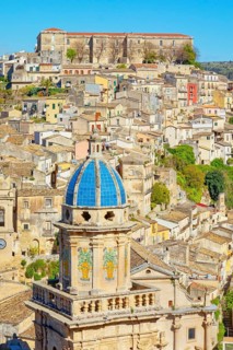 Elevated view of the church of Santa Maria dell'Itria and Ragusa Ibla in the distance, Ragusa Ibla,