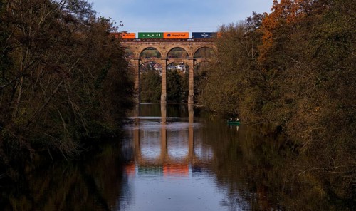 Freight train, container from Hapag-Lloyd, UASC, train stains on railway viaduct, viaduct, railway