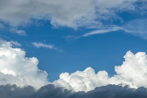 Down back Cumulus cluster clouds above part of Altostratus layer cloud in the middle window gap