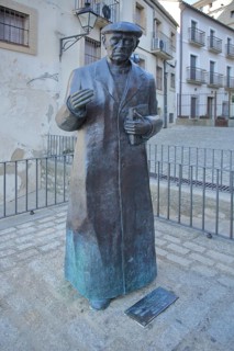 Sculpture and monument to priest Don Ramon Nunez Martin, statue man with book, life-size, bronze