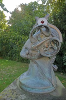 Sensilbilia sculpture by Jürgen Görtz 1992, modern art, bizarre head with big ears, castle park,
