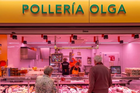 Market stall shop store selling chicken meat products inside Mercado Central de Zaragoza, Zaragoza,