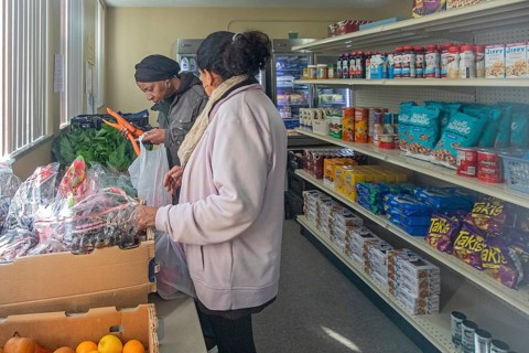 Detroit, Michigan USA - 4 November 2025 - People pick up groceries at the nonprofit Deo Gratias