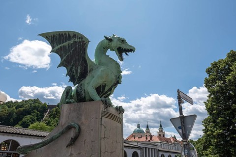 Green dragon statue on Dragon Bridge (Zmajski Most) in Ljubljana, Slovenia
