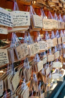 Ema, small wooden tablets with wishes and prayers, hung so that the Kami spirits or gods can