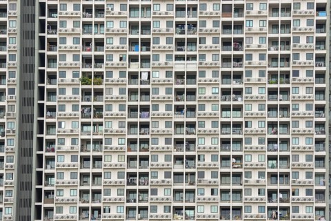 Exterior façade of a residential high-rise building of Condo U (a brand or series name of the Thai