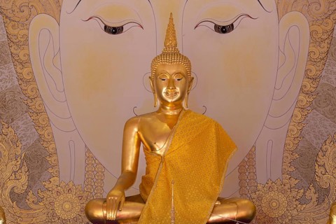 Golden Buddha statue with tunic, Bhumispara mudra, Buddha Gautama at the moment of enlightenment,