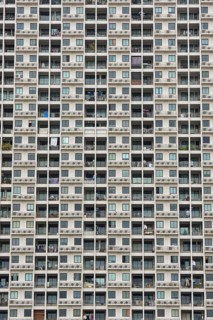 Exterior façade of a residential high-rise building of Condo U (a brand or series name of the Thai
