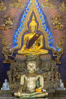 Buddha statue decorated with gold leaf, Bhumispara mudra, Buddha Gautama at the moment of