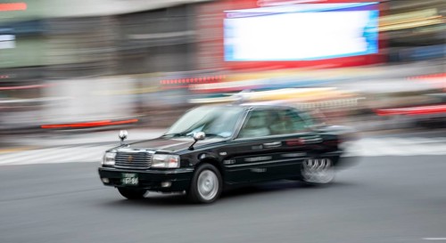 Black taxi driving, motion blur, long exposure, Shubuya Crossing, Shibuya, Tokyo, Japan