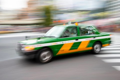 Green taxi driving, motion blur, long exposure, Shubuya Crossing, Shibuya, Tokyo, Japan