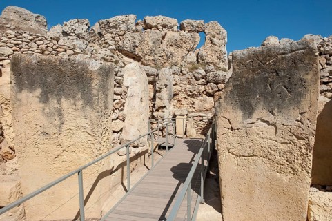 View from secured walkway with railing through ruins remains of Ggantija temple, UNESCO World
