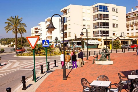 Pedestrian area at the harbor, tables and chairs of a cafe, Moraira, former fishing village, pearl