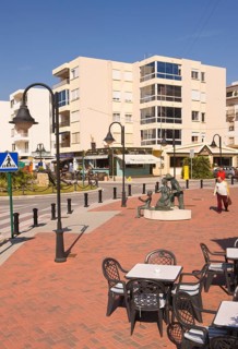 Pedestrian area at the harbor, tables and chairs of a cafe, Moraira, former fishing village, pearl