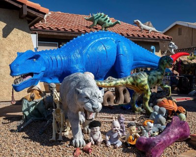 Henderson, Nevada - Dinosaurs dominate the yard of a house in suburban Las Vegas, placed there by