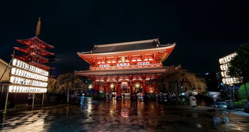 Illuminated five-story pagoda and main hall of Asakusa Shrine or Senso-ji Temple, at night,