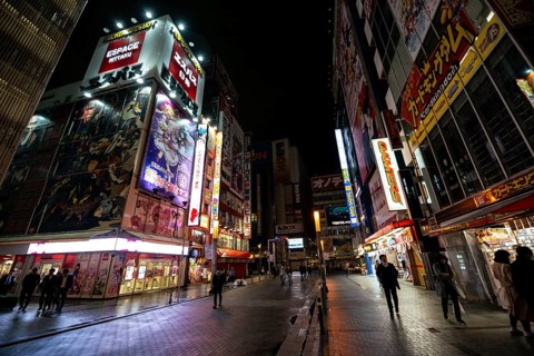 Street with illuminated shops and neon signs at night in Akihabara, Electric City, Tokyo, Japan