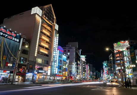 Street and neon sign, long exposure street scene at night, Tokyo, Japan