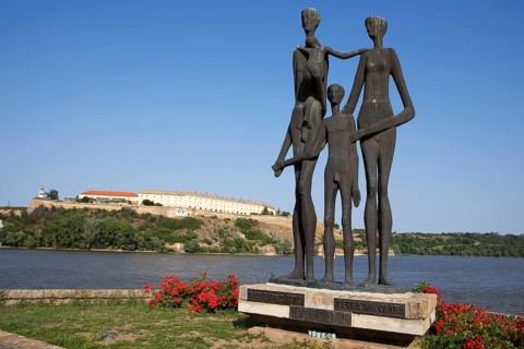 Memorial to the victims of the Novi Sad massacre, in the back the Petrovaradin Fortress or