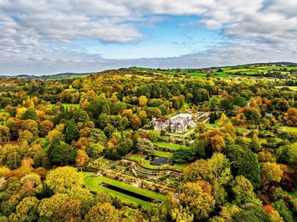 Autumn colours over Bodnant House and Garden from a drone, Conwy River, Colwyn Bay, Conwy, Wales,