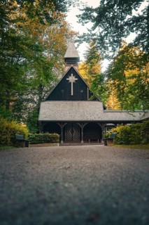 Wooden church in the forest, surrounded by trees in an atmospheric evening atmosphere, Altensteig,