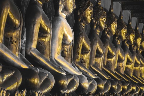 Gilded Buddha statues (Bhumispara mudra: Buddha Gautama at the moment of enlightenment), Wat Suthat
