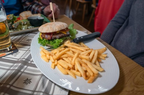 Burger, minced meat with grilled ham and French fries served in an inn, Franconia, Bavaria, Germany