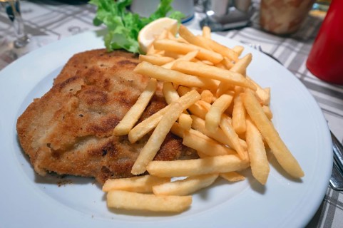 Wiener schnitzel served with french fries in an inn, Franconia, Bavaria, Germany