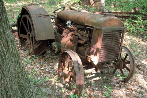 Rusted American Fordson tractor around 1900, dumped in a wooded area, Marksboro, New Jersey, USA
