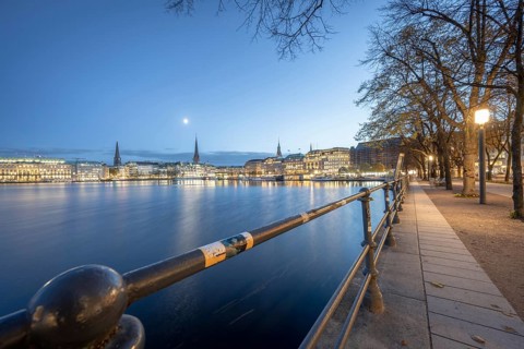 Inner Alster with footpath along Neuer Jungfernstieg at Blaue Stunde, Hamburg, Germany