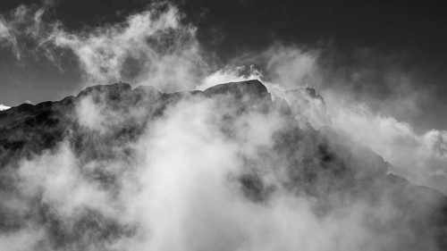 View from Brandhorn to the summit of the Hochkönig with the Matrashaus and atmospheric clouds,