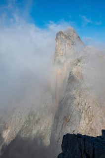 Summit of Wildalmkirchl with steeply sloping rock face surrounded by clouds, Steinernes Meer,
