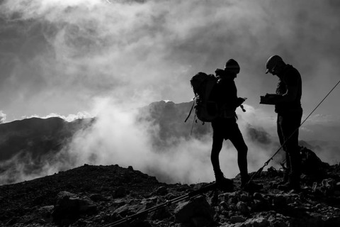 Two mountaineers on the summit of the Brandhorn in the Steinernes Meer, in the background the