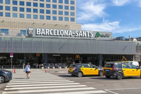 Taxis in street outside Barcelona-Sants railway station building in city centre, Barcelona,