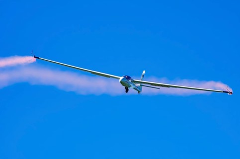 An SZD-59-1 ACRO glider, registration D-1138, during a demonstration as part of an air show at the