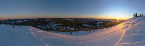 View from Mount Lusen over the hills of the bavarian forest at sunrise in winter, Bavaria, Germany